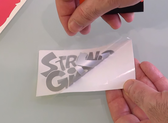 Removing the vinyl with a paper-based application tape