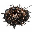 Green garland for Christmas tree with flashing white LED lights